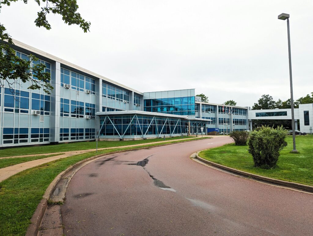 Contemporary university building in Truro, Nova Scotia with sleek glass architecture.