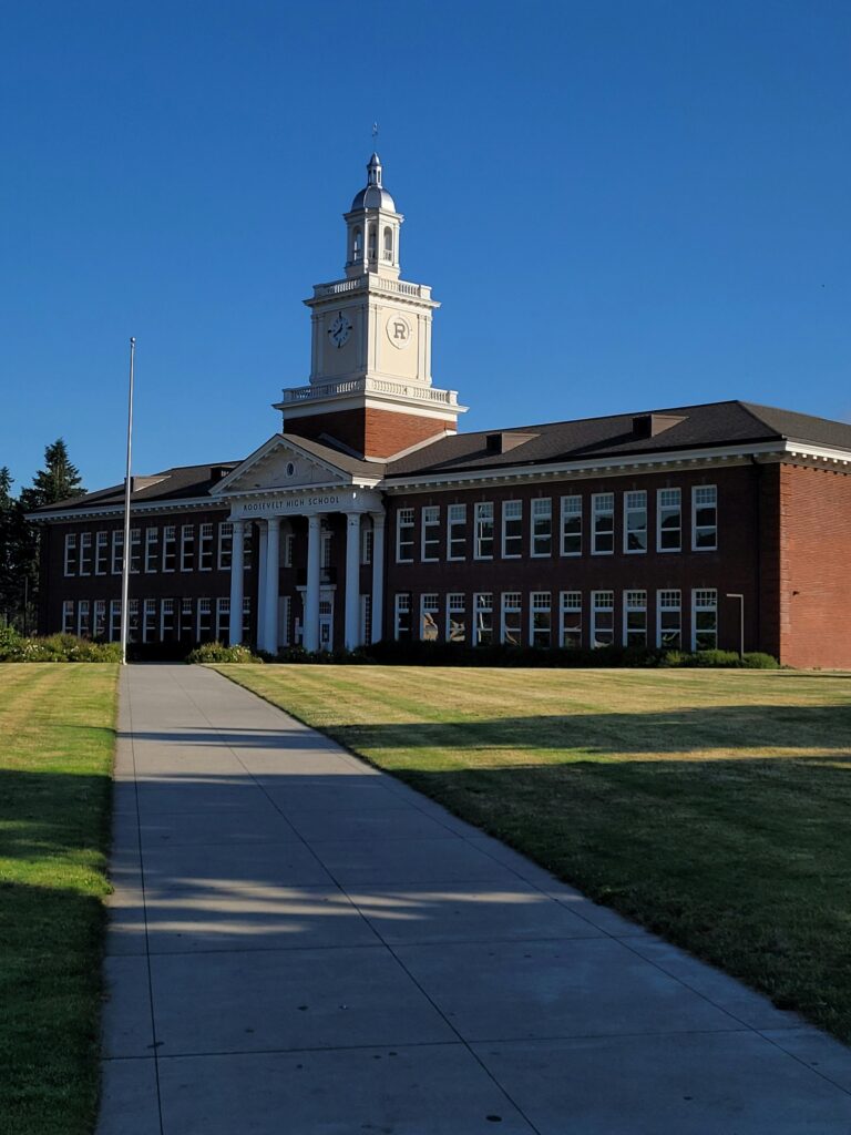 A front view of the historic Roosevelt High School building in Portland, Oregon, USA.