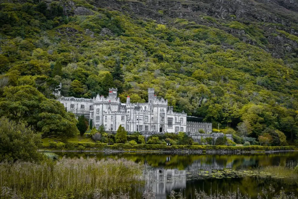 Scenic view of Kylemore Abbey and its reflection in a tranquil lake, Connemara, Ireland.