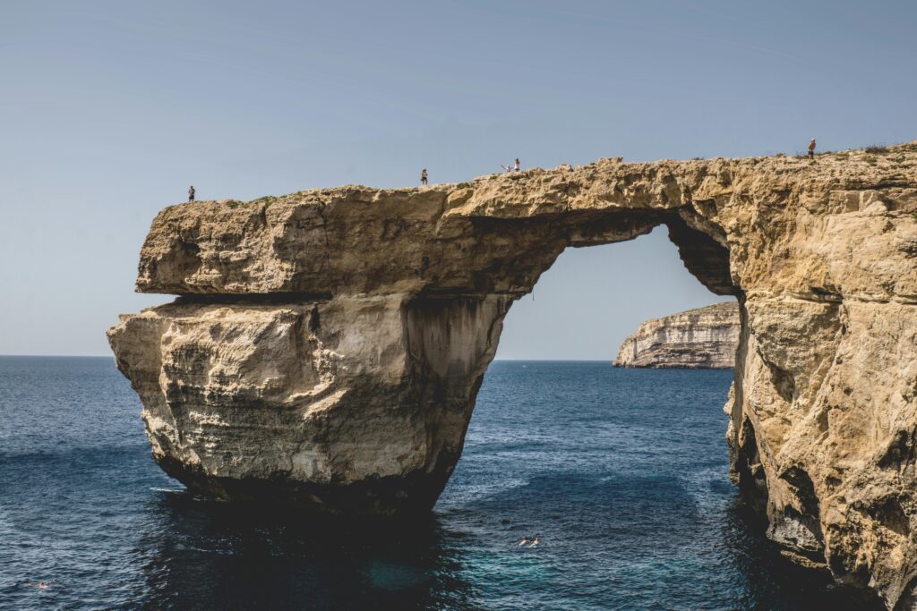 Stunning view of the Azure Window in Gozo, Malta, showcasing the arch formation on a sunny day.